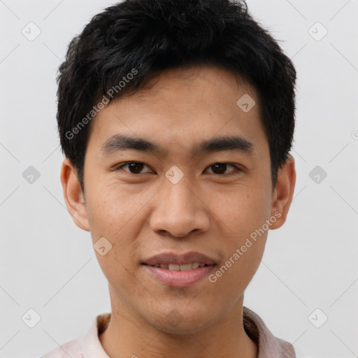 Joyful asian young-adult male with short  black hair and brown eyes