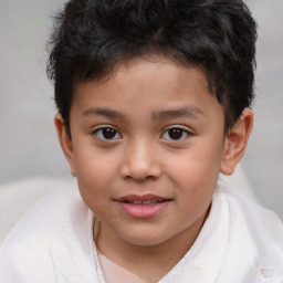 Joyful white child male with short  brown hair and brown eyes