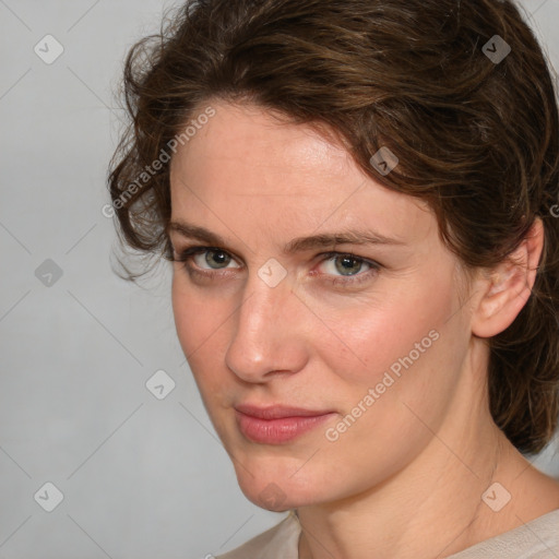 Joyful white young-adult female with medium  brown hair and blue eyes