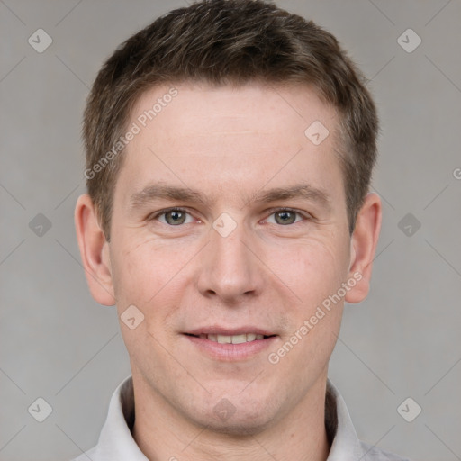 Joyful white adult male with short  brown hair and grey eyes