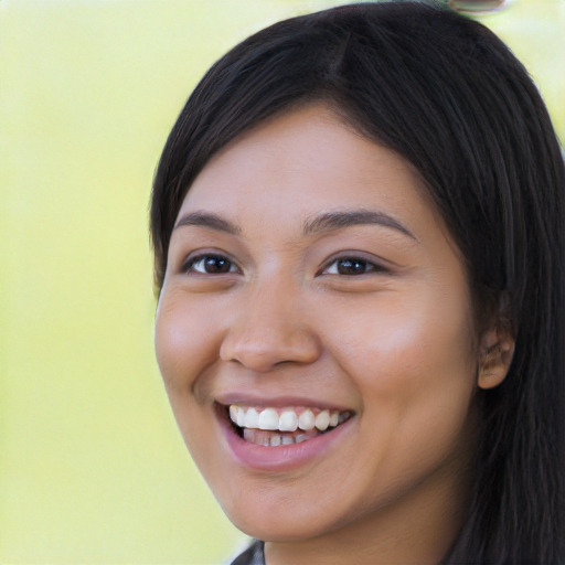 Joyful latino young-adult female with long  black hair and brown eyes