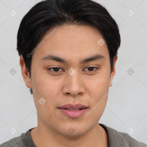 Joyful asian young-adult male with short  brown hair and brown eyes