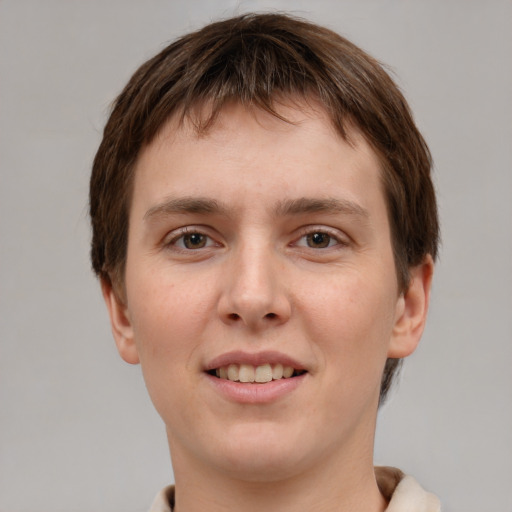 Joyful white young-adult female with short  brown hair and grey eyes