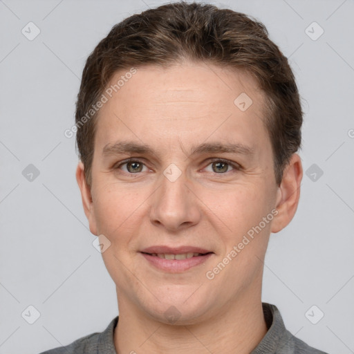 Joyful white adult male with short  brown hair and grey eyes