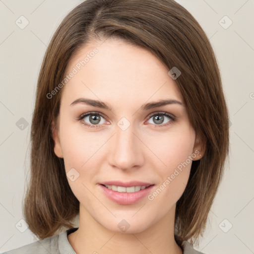 Joyful white young-adult female with medium  brown hair and green eyes