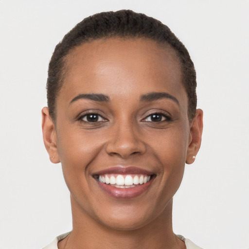 Joyful latino young-adult female with short  brown hair and brown eyes