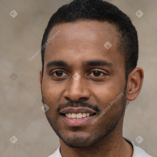 Joyful black young-adult male with short  black hair and brown eyes