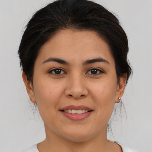 Joyful asian young-adult female with medium  brown hair and brown eyes