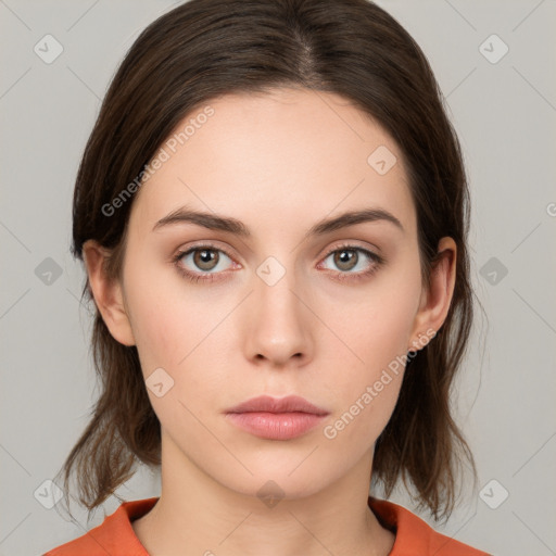 Neutral white young-adult female with medium  brown hair and brown eyes