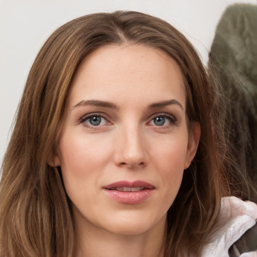 Joyful white young-adult female with long  brown hair and grey eyes