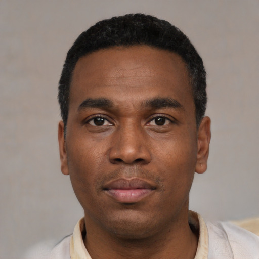 Neutral black young-adult male with short  black hair and brown eyes