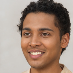 Joyful latino young-adult male with short  brown hair and brown eyes