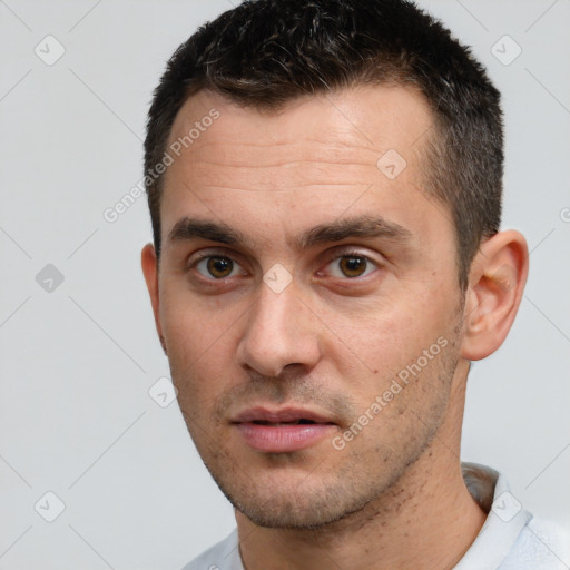 Neutral white young-adult male with short  brown hair and brown eyes