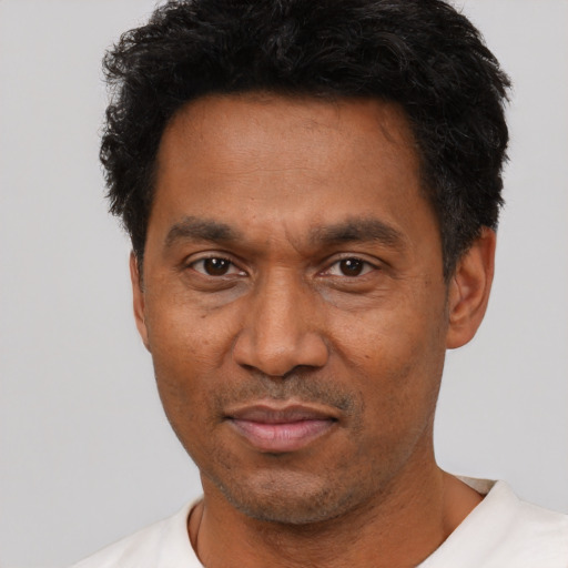 Neutral latino adult male with short  black hair and brown eyes