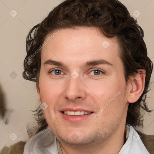 Joyful white young-adult male with medium  brown hair and brown eyes