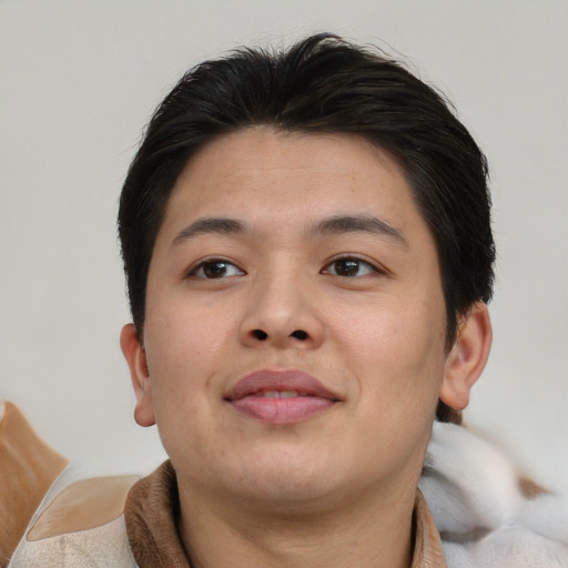 Joyful asian young-adult male with short  brown hair and brown eyes