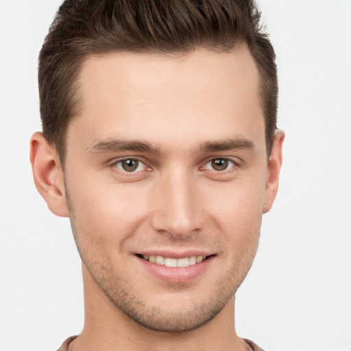 Joyful white young-adult male with short  brown hair and brown eyes