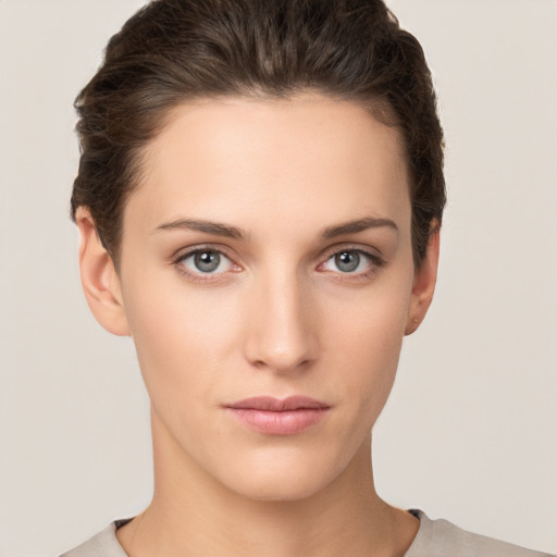 Neutral white young-adult female with short  brown hair and brown eyes