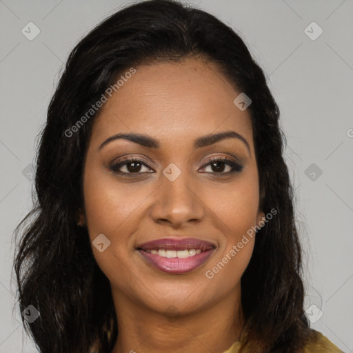 Joyful black young-adult female with long  brown hair and brown eyes