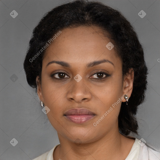 Joyful black young-adult female with long  brown hair and brown eyes