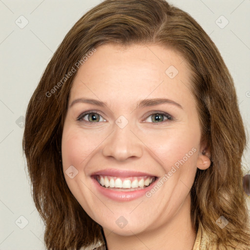 Joyful white young-adult female with long  brown hair and green eyes