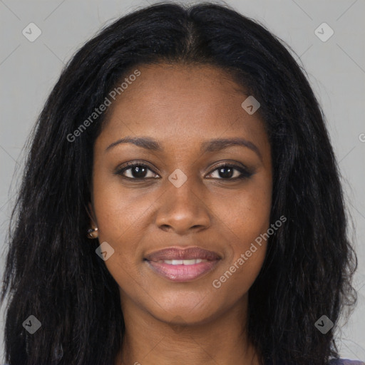 Joyful black young-adult female with long  black hair and brown eyes