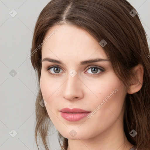 Neutral white young-adult female with long  brown hair and grey eyes