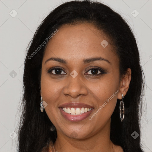 Joyful black young-adult female with long  brown hair and brown eyes