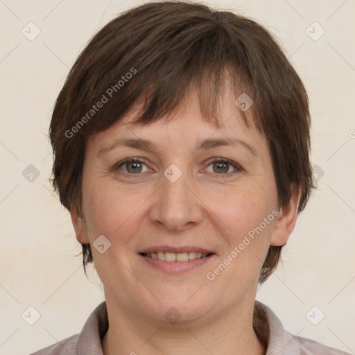 Joyful white adult female with medium  brown hair and grey eyes