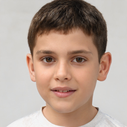 Joyful white child male with short  brown hair and brown eyes