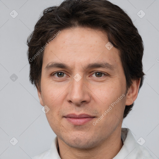 Joyful white adult male with short  brown hair and brown eyes