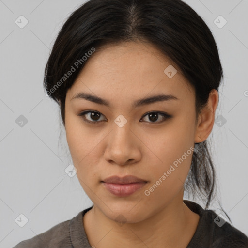 Joyful asian young-adult female with long  brown hair and brown eyes