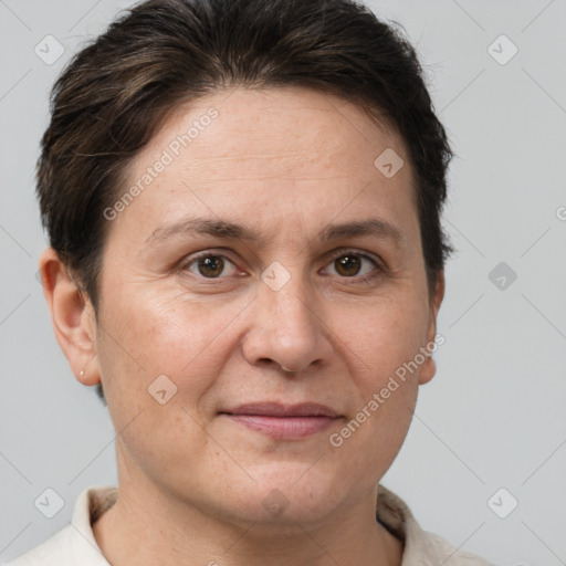 Joyful white adult female with short  brown hair and brown eyes