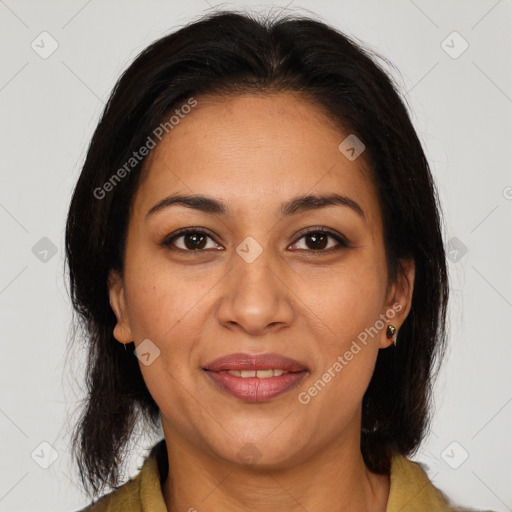 Joyful latino adult female with medium  brown hair and brown eyes