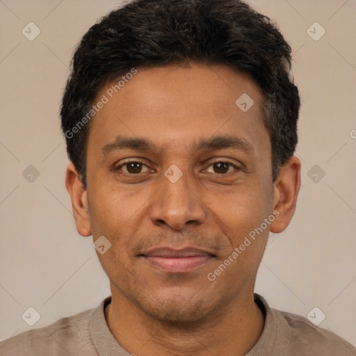 Joyful latino adult male with short  black hair and brown eyes