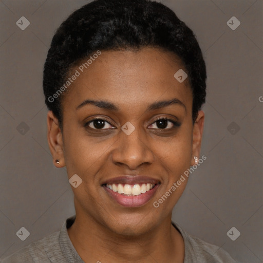 Joyful black young-adult female with short  black hair and brown eyes