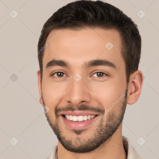 Joyful white young-adult male with short  brown hair and brown eyes