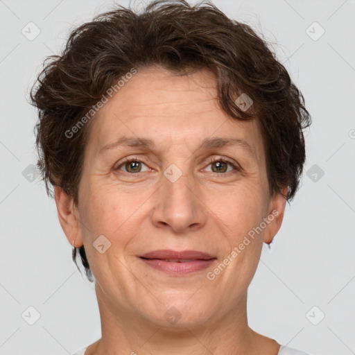 Joyful white adult female with short  brown hair and brown eyes