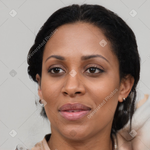 Joyful black adult female with medium  brown hair and brown eyes