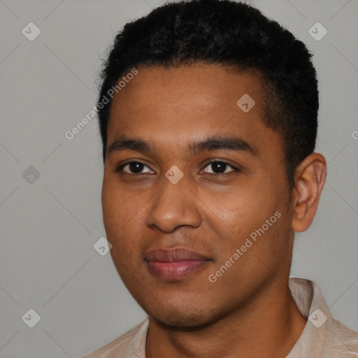 Joyful black young-adult male with short  black hair and brown eyes
