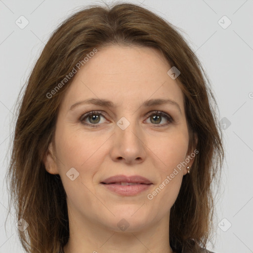 Joyful white adult female with medium  brown hair and grey eyes