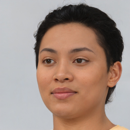 Joyful asian young-adult female with short  black hair and brown eyes