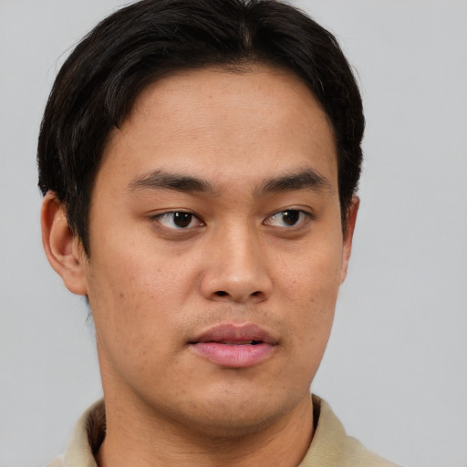Neutral asian young-adult male with short  brown hair and brown eyes