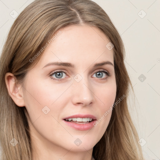 Joyful white young-adult female with long  brown hair and blue eyes