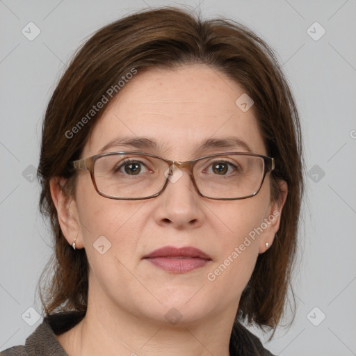 Joyful white adult female with medium  brown hair and grey eyes