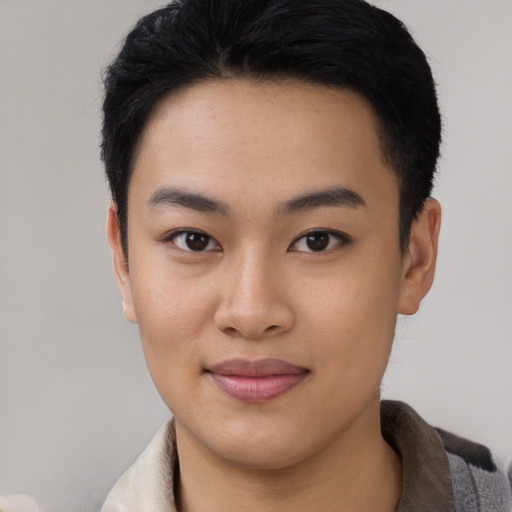 Joyful asian young-adult female with short  black hair and brown eyes