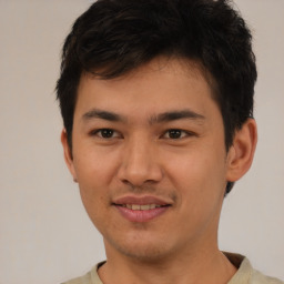 Joyful asian young-adult male with short  brown hair and brown eyes