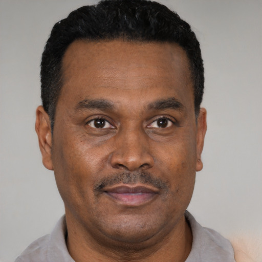Neutral black adult male with short  black hair and brown eyes