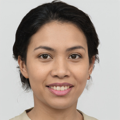 Joyful white young-adult female with medium  brown hair and brown eyes