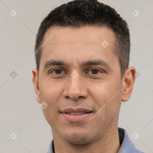 Joyful white adult male with short  brown hair and brown eyes